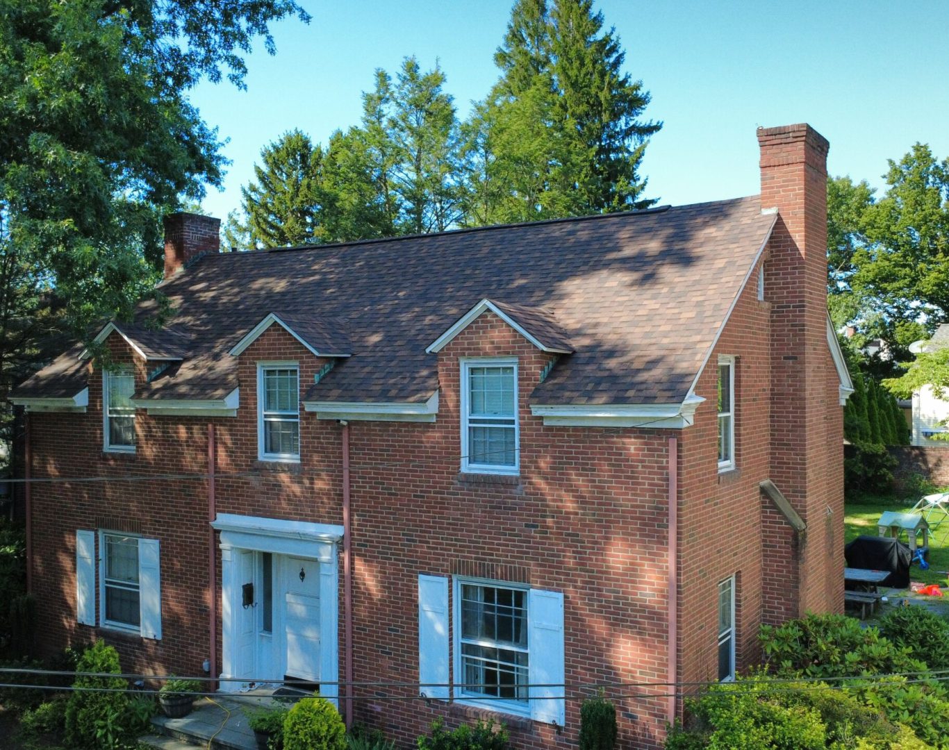 Professional Roof Repair in Pittston, PA repairing damaged shingles on residential roofing system