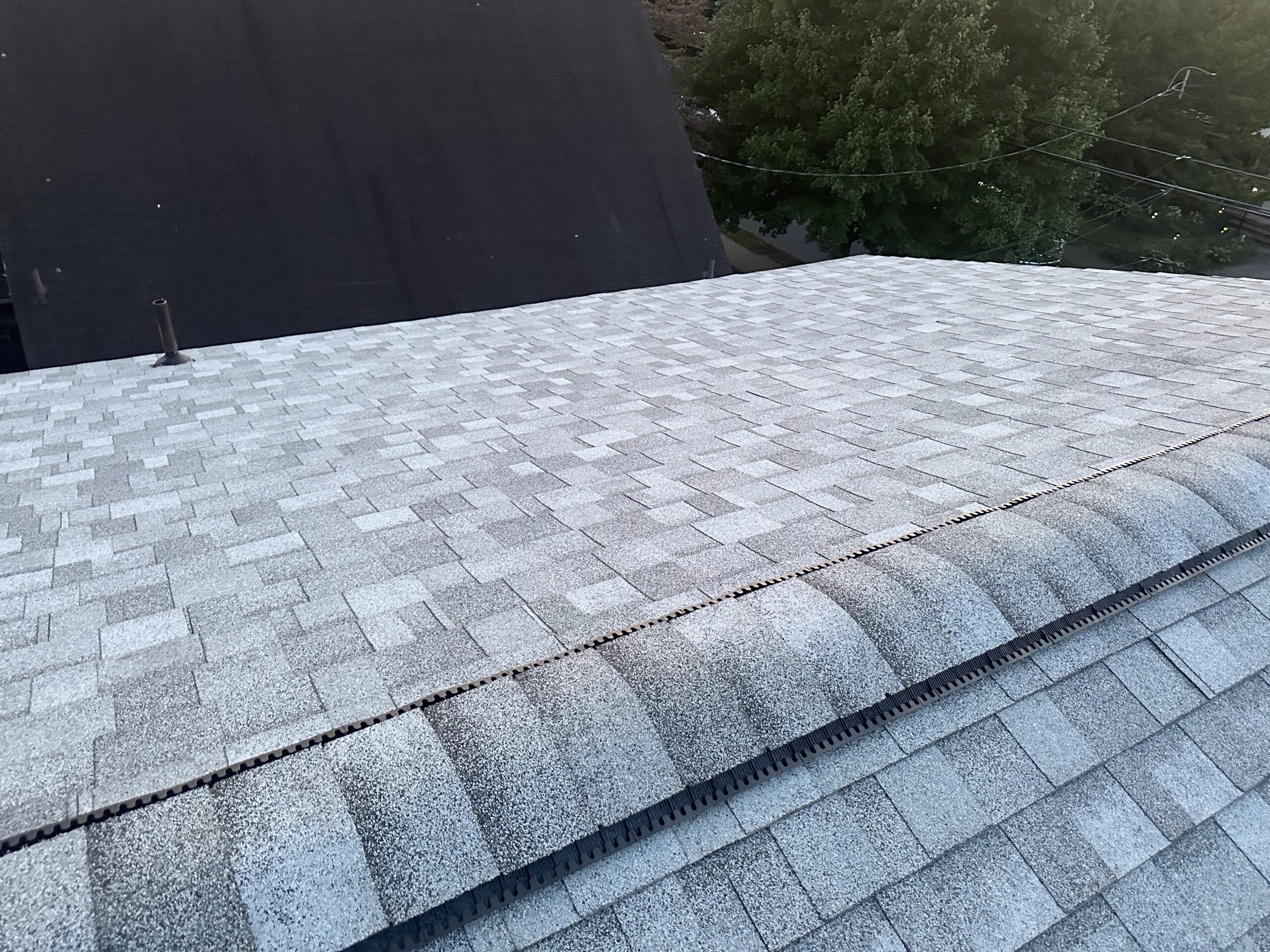 Professional Roof Repair in Shavertown, PA fixing damaged shingles on residential roofing system