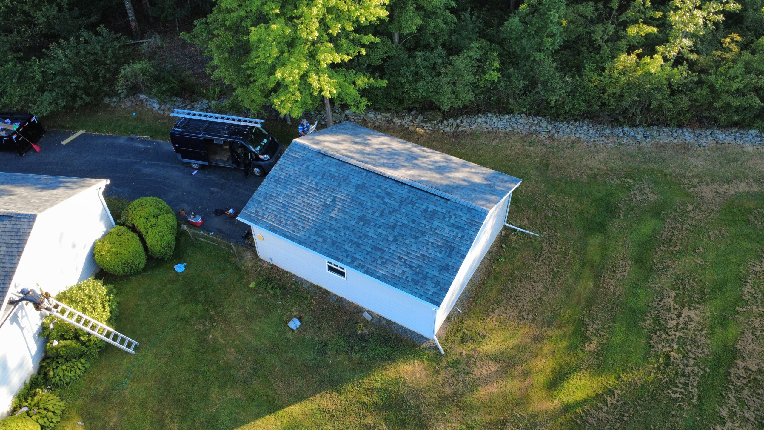 Professional Roof Repair in Swoyersville, PA fixing damaged shingles on residential roofing system