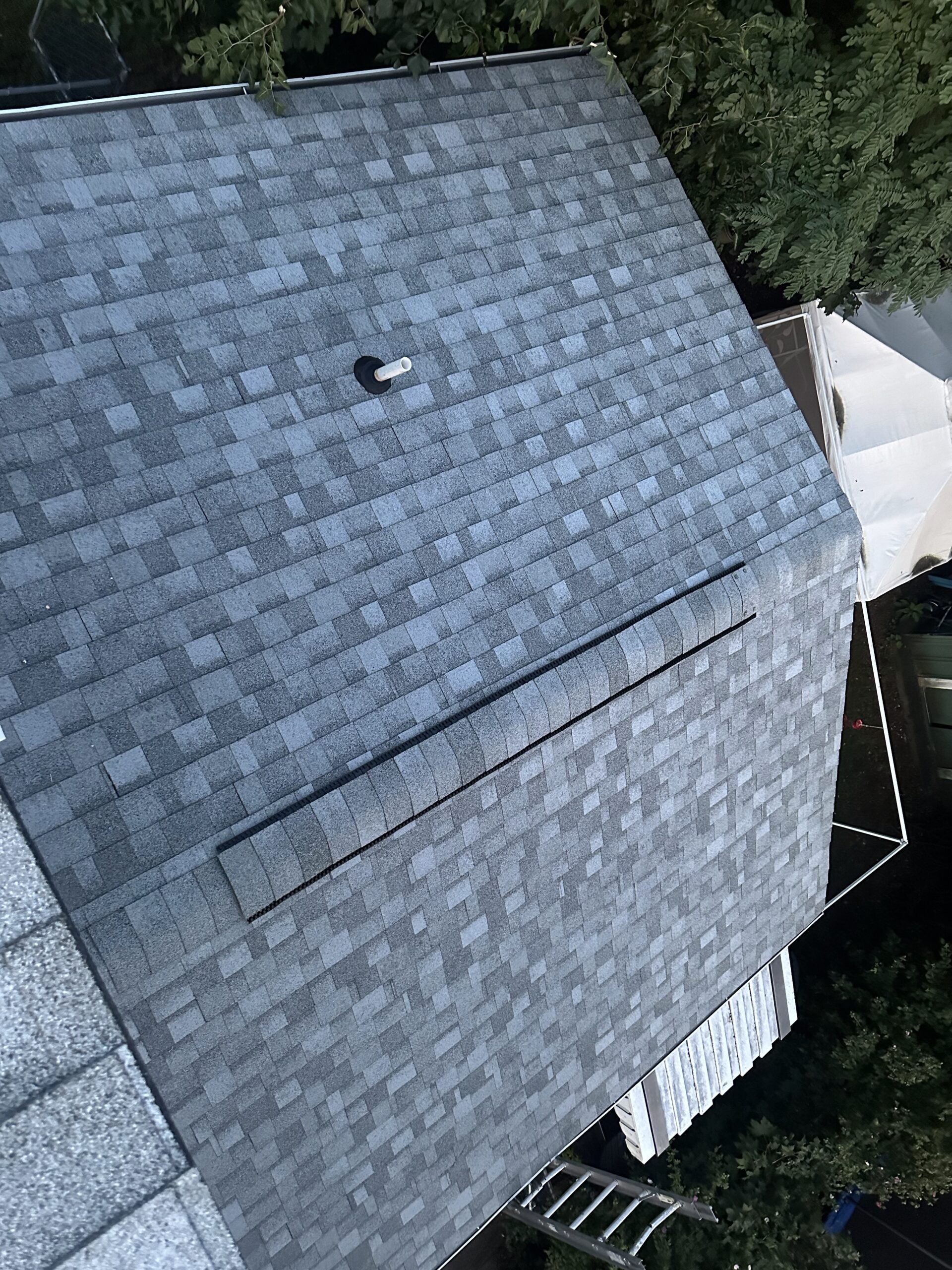 Professional Roof Repair in Moosic, PA repairing damaged shingles on residential roofing system
